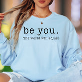 "be you. The world will adjust" | Bold Typography Unisex Adult Long Sleeve T-Shirt | Confidence Lifestyle