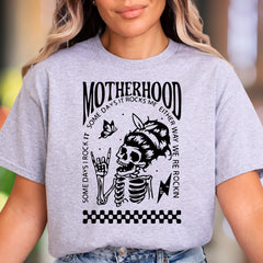 "Motherhood - Some Days I Rock It, Some Days It Rocks Me" | Bold Retro Unisex Adult T-Shirt | Edgy Mom Life