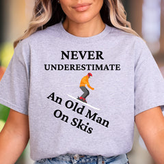 "Never Underestimate An Old Man On Skis" | Funny Graphic Unisex Adult T-Shirt | Skier Lifestyle