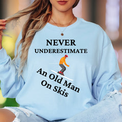 "Never Underestimate An Old Man On Skis" | Funny Illustrated Unisex Adult Long Sleeve T-Shirt | Skiing Humor