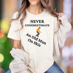 "Never Underestimate An Old Man On Skis" | Funny Graphic Unisex Adult T-Shirt | Skier Lifestyle
