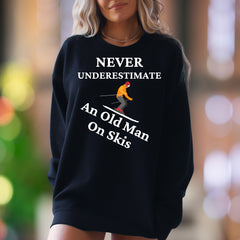 "Never Underestimate An Old Man On Skis" | Funny Graphic Unisex Adult Sweatshirt | Skiing Humor